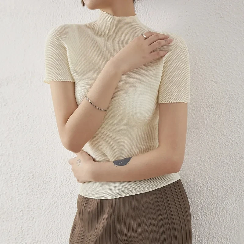 Nuevo Top plisado para mujer, camiseta de manga corta con cuello redondo ajustada elástica y elegante con temperamento para primavera y verano