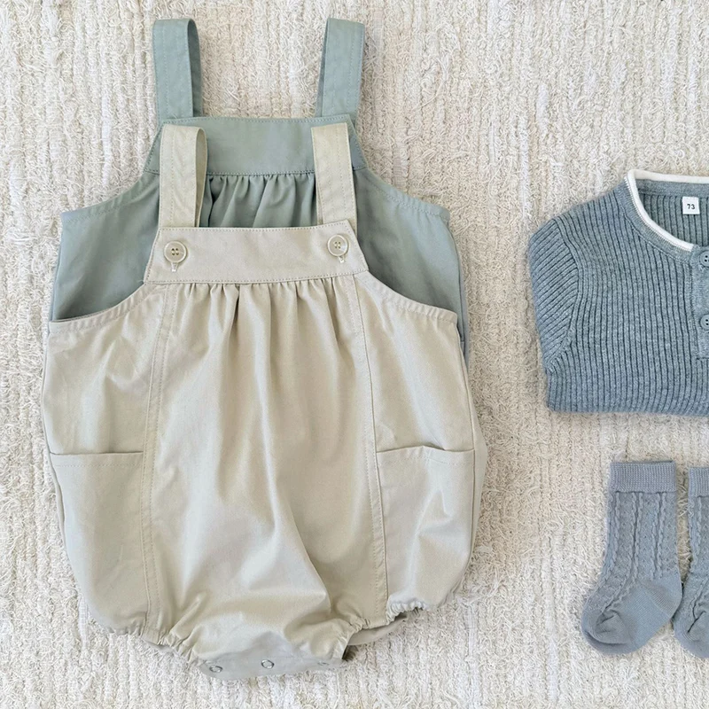 ربيع جديد 2026 ملابس أطفال 0-24 متر ملابس أطفال حديثي الولادة من البنات والأولاد بدون أكمام بلون سادة بدلة تسلق على الطراز الكوري من القطن