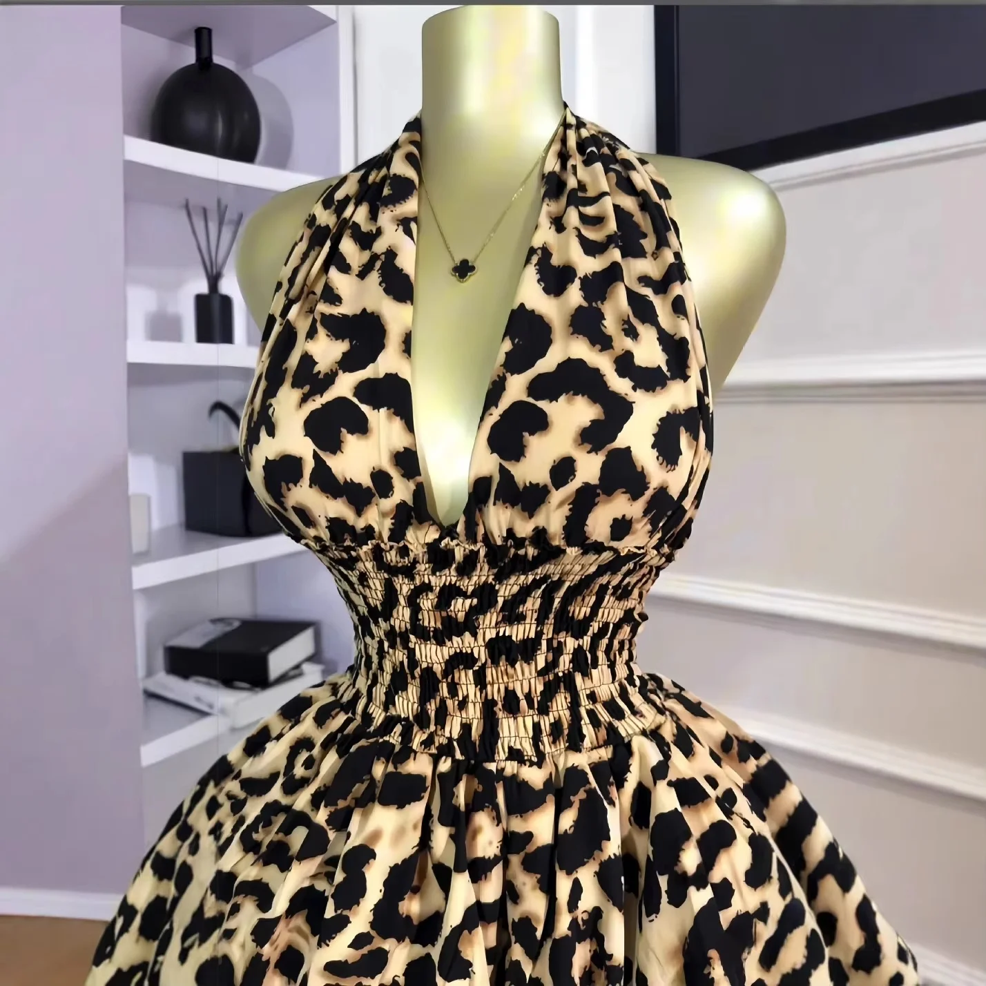 Close-up of leopard print fabric with gathered waist detail and soft ruffle texture
