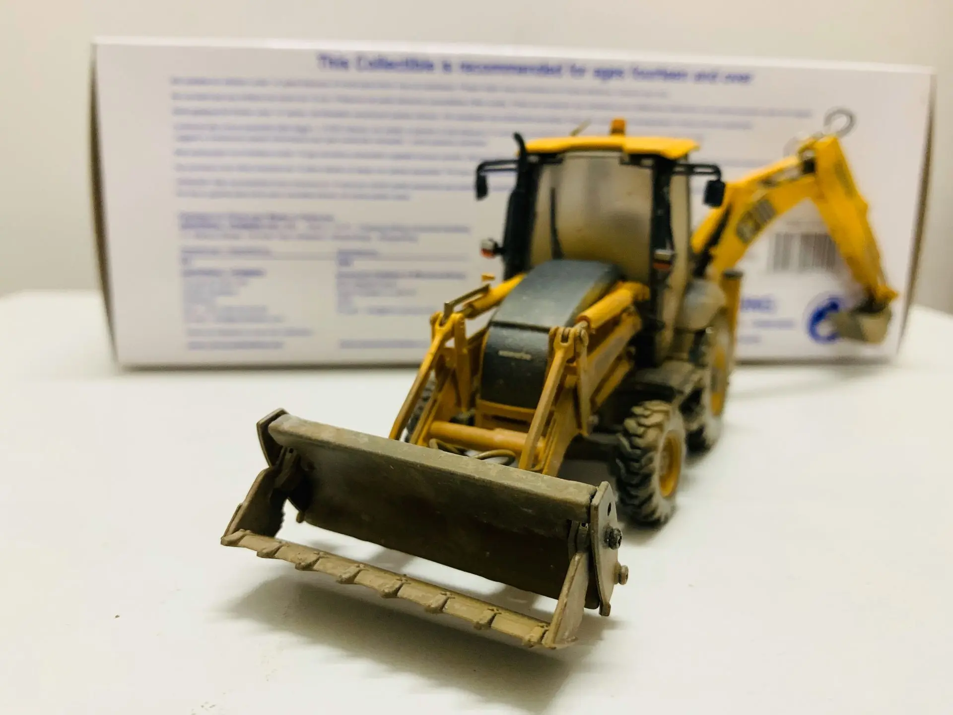 Komatsu WB93R-8 Backhoe Loader Muddy Version 1:50 Scale DieCast Model UH8142 New