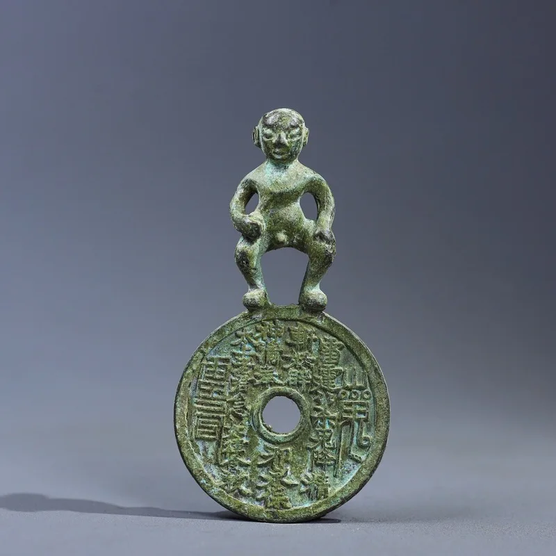 Antiqued child-shaped , mountain ghost amulet, talismanic , , ancient , copper coin