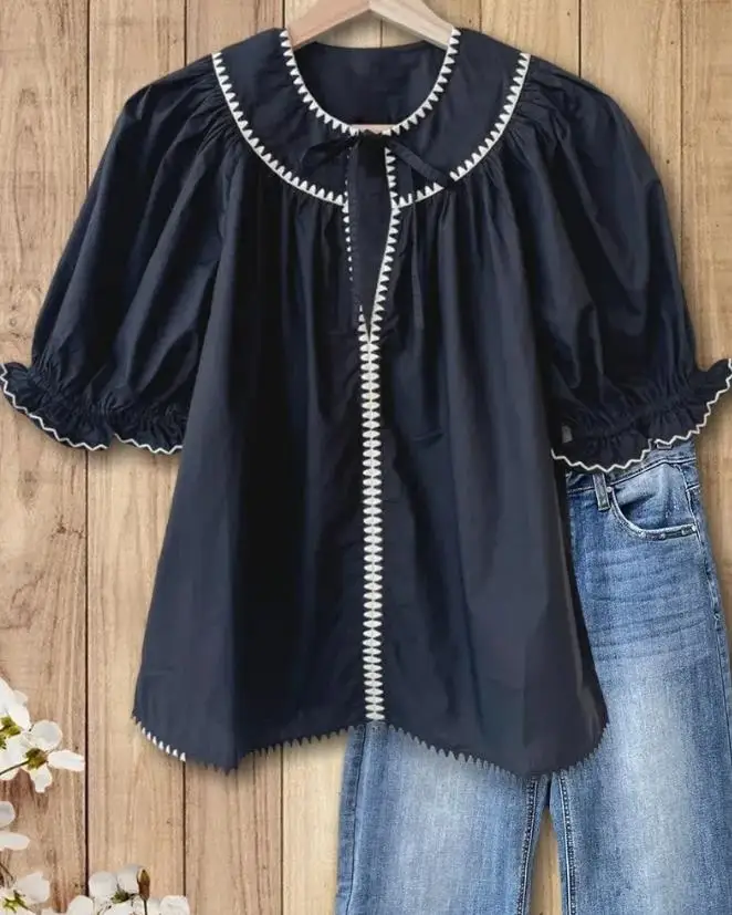 

Women's Shirt 2026 New Solid Color Embroidered Round Neck Ruffle Edge Short Sleeved Shirt Commuting Retro Elegant Shirt