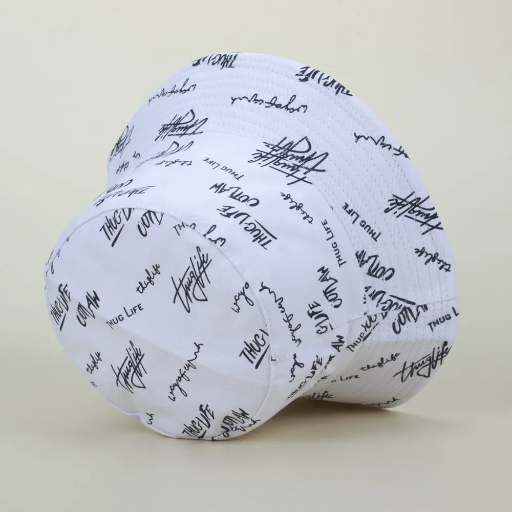 Street style featuring bold handwritten English graffiti on the hat, fisherman hat with a trendy wide brim, hip-hop hat