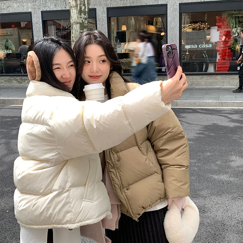 Abrigo 2025, nueva moda, chaqueta de plumón de Color sólido con cuello levantado para mujer, chaqueta de plumón de pato blanco para invierno, chaqueta corta gruesa para mujer H211