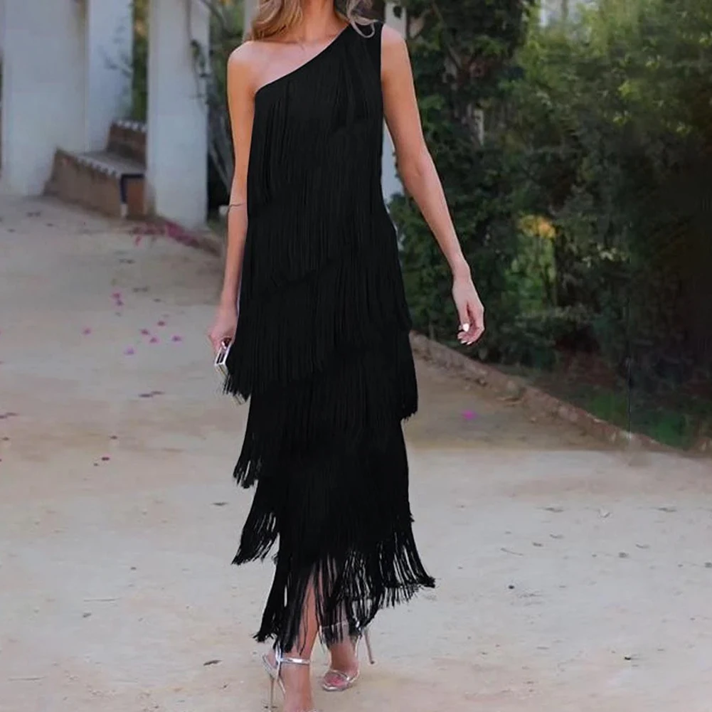 

Sophisticated Women's Evening Wear featuring Unique Styling of the Diagonal Neckline & Cascading Layers of Decorative Tassels