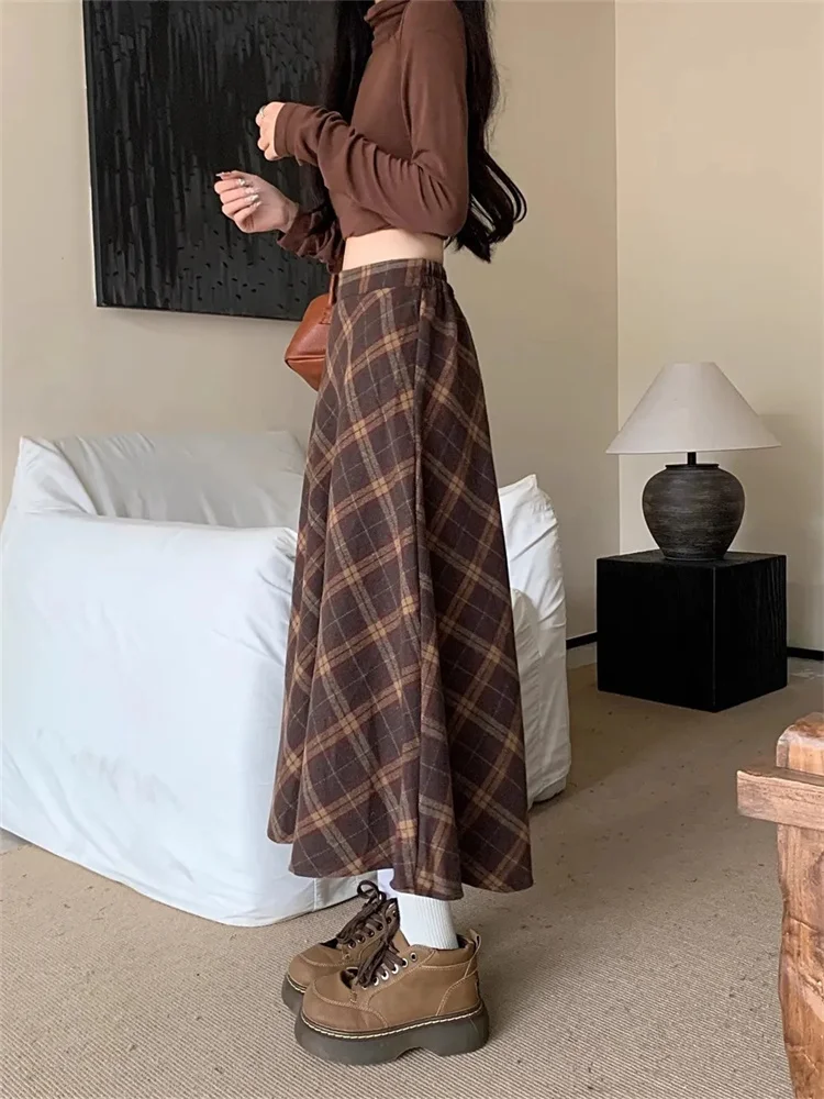 تويد منقوشة عالية الخصر نصف الجسم تنورة الإناث الخريف والشتاء جديد ريترو فضفاض ساحات كبيرة الترفيه طويلة ألف خط نصف الجسم تنورة