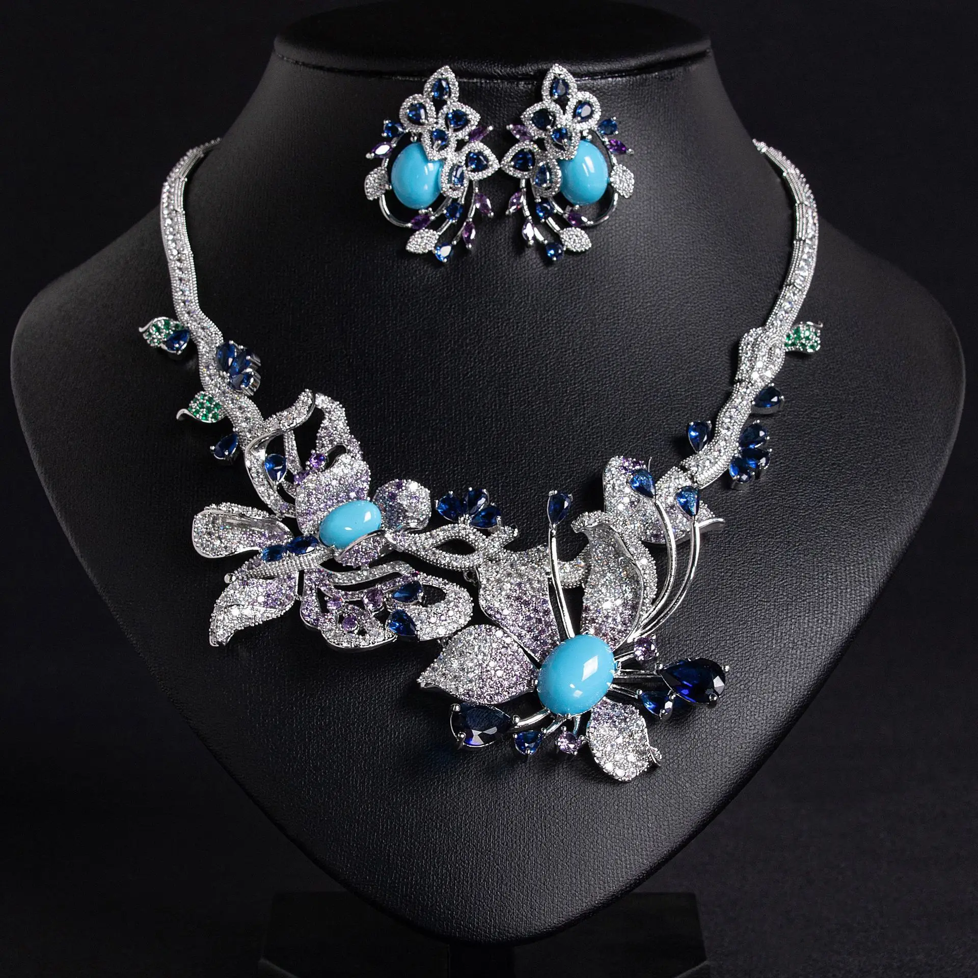 

Iris Blue Sapphire Full Diamond Necklace and Butterfly Flower Sparkling Earring Set