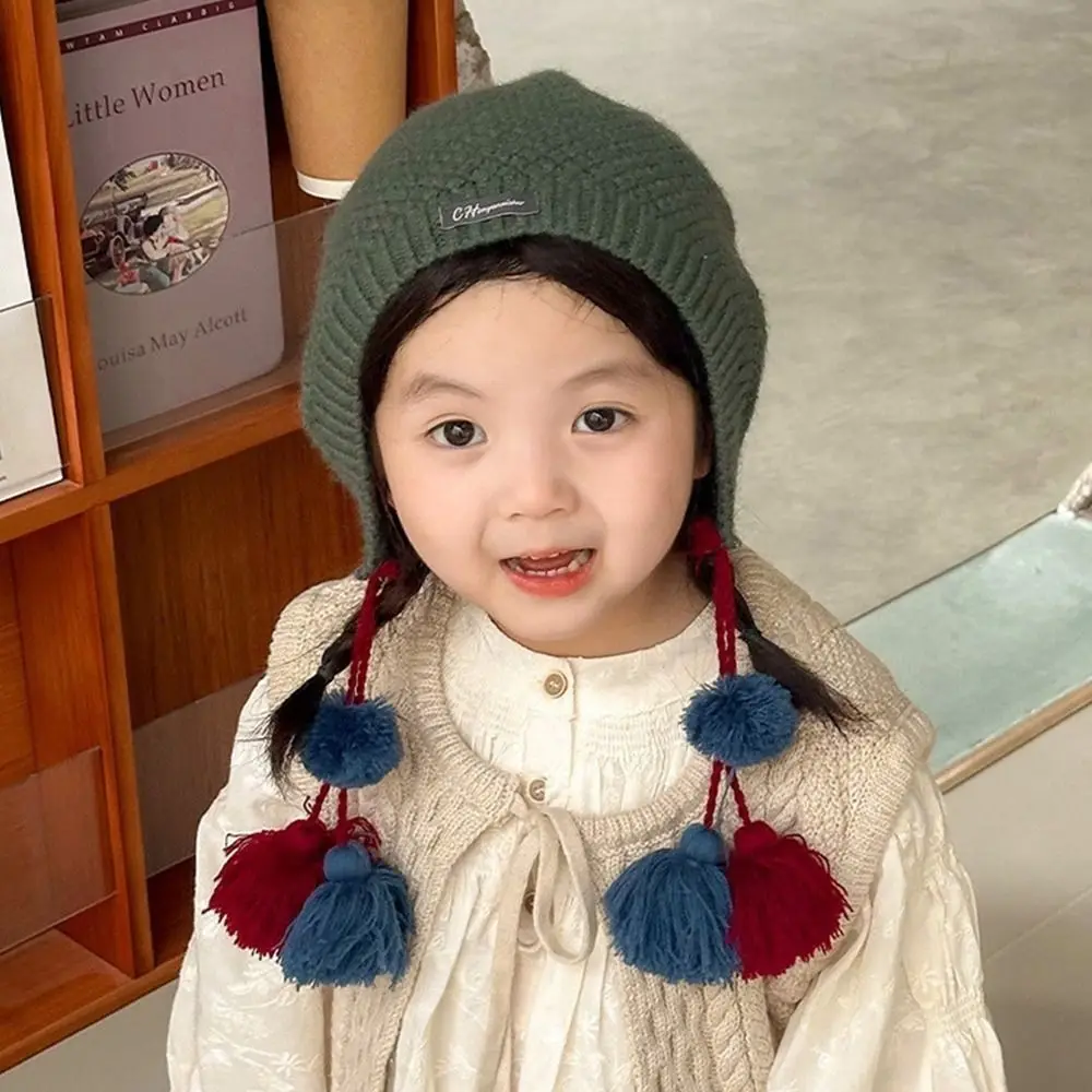 Gorro con borlas de estilo étnico para niños, gorro coreano de ganchillo hecho a mano para otoño e invierno, protección cálida para los oídos, gorro tejido para niñas