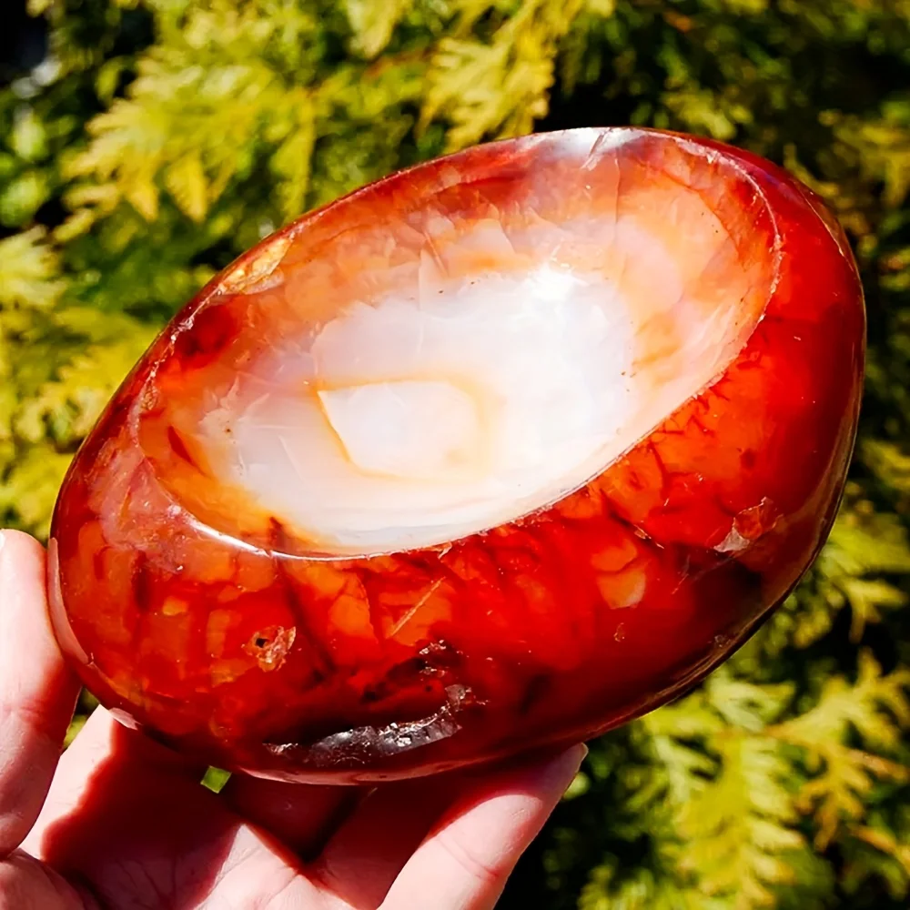 A rare carnelian agate crystal bowl - an elegant bohemian-style home décor with a polished natural stone appearance.