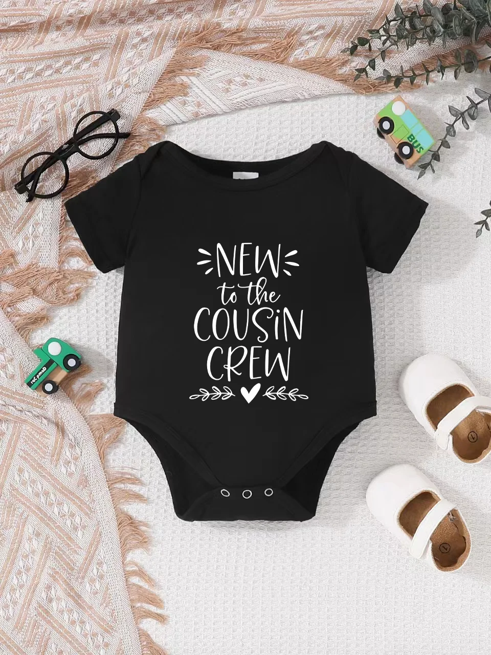 

Playful letter-printed baby short-sleeve triangle bodysuit. Button closure for easy dressing