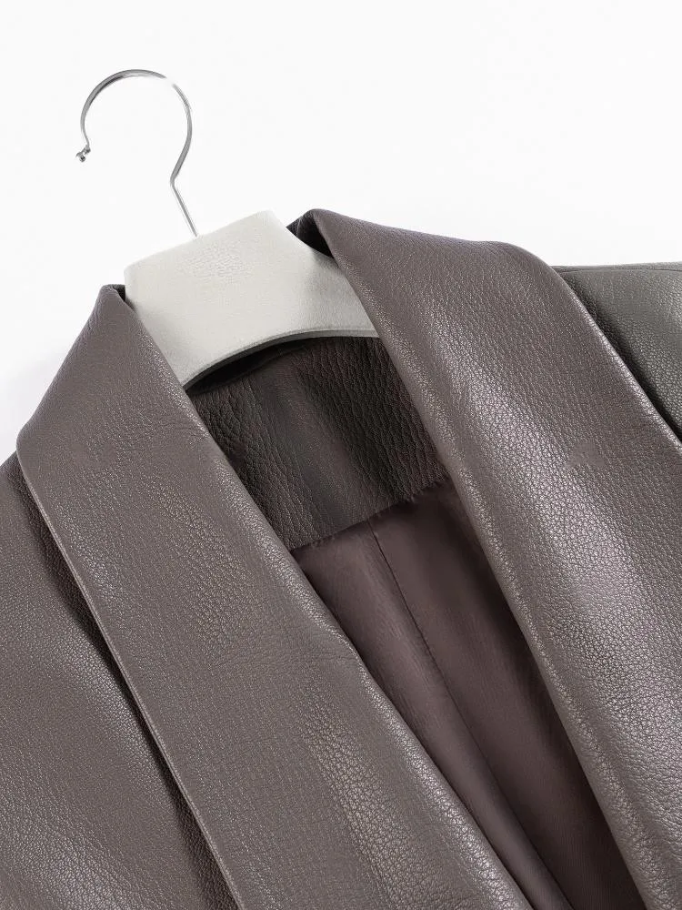 เสื้อแจ็คเก็ตหนังแท้สีพื้นสำหรับผู้หญิง ทรงหลวม คอวี แขนยาว ทำมือ ดีไซน์หรูหราทันสมัย ผลิตจากหนังแกะ