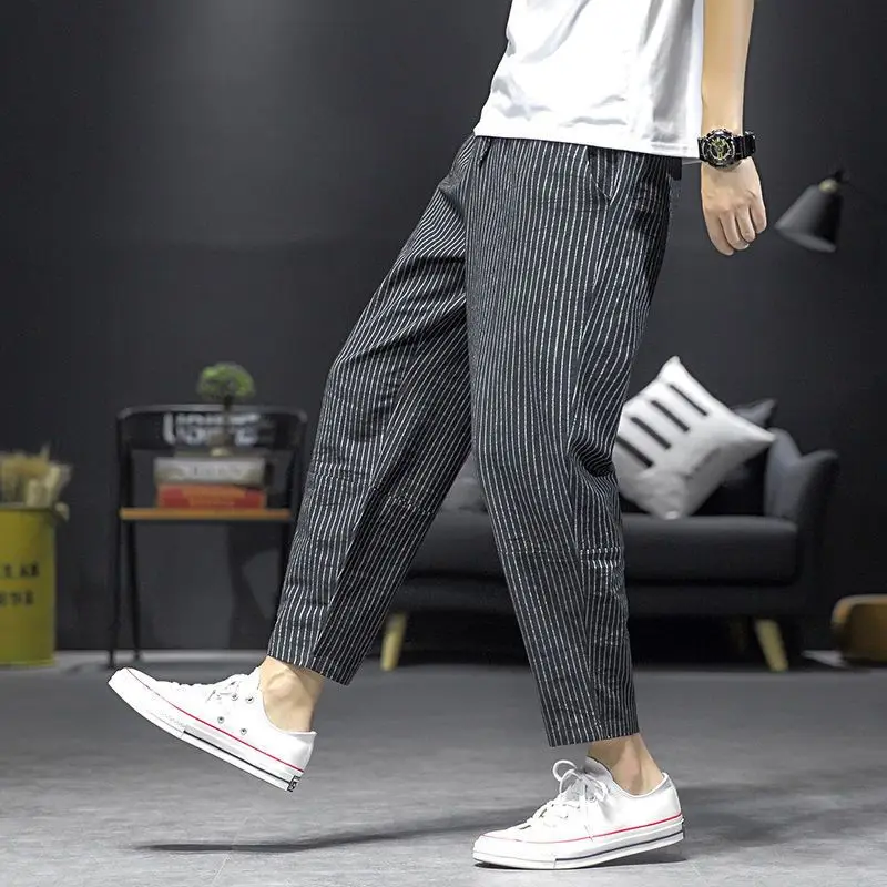 Pantalones holgados de cintura elástica para hombre, pantalones cómodos informales a la moda, con bolsillos, a rayas, simplicidad, primavera y verano, 2023