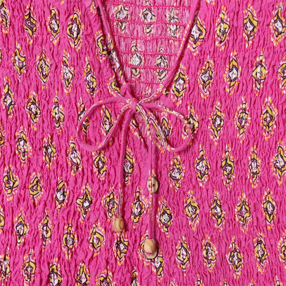 بلوزة نسائية صيفية جديدة لقضاء العطلات على شكل قرص العسل مطبوعة برقبة على شكل حرف V بدون أكمام وتنورة ميدي عالية الخصر