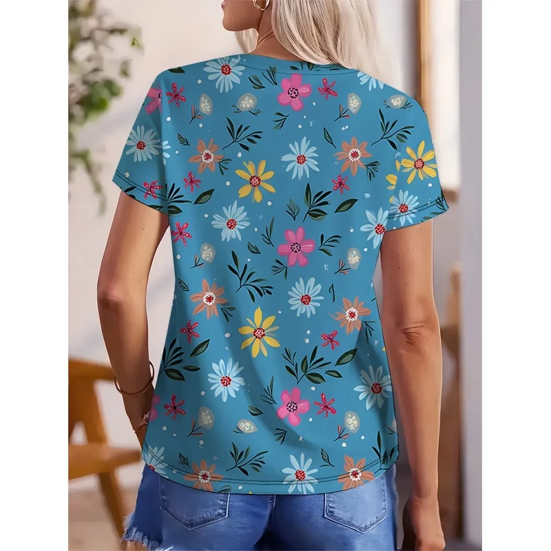 Women's Elegant V-Neck Short-Sleeve T-Shirt with Vibrant Whimsical Garden Print - Cheerful Floral Pattern on Blue Background