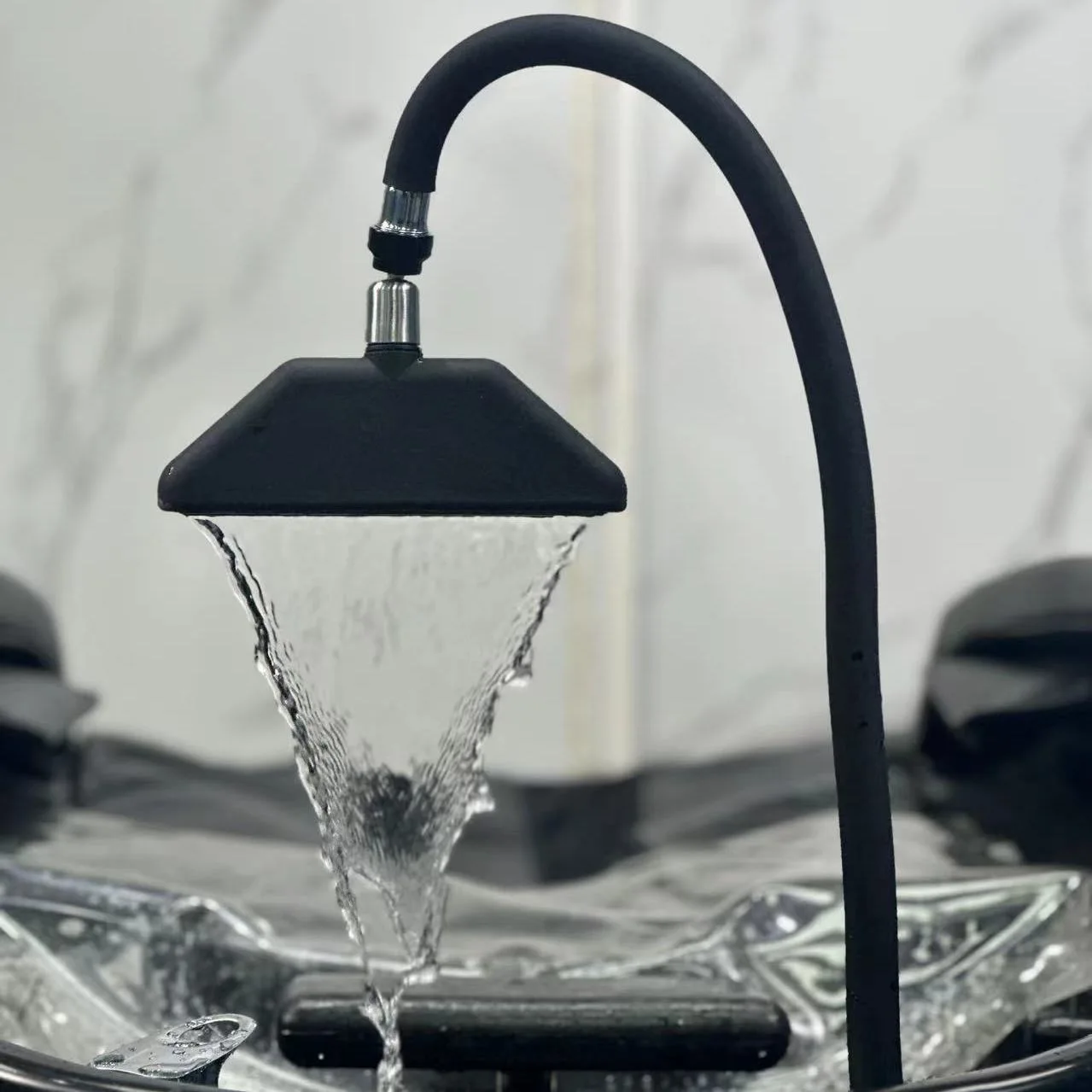 Adjustable water circulation shampoo basin with modern waterfall-style shampoo spray head and faucet
