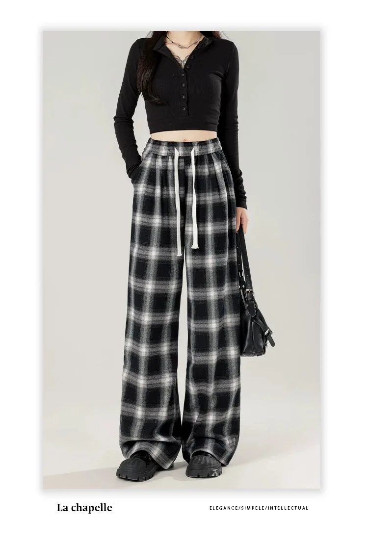 女性用の特大の黒い市松模様のスウェットパンツ,だぶだぶのカジュアルパンツ,伸縮性のあるウエスト,ポケット,学生,ユニセックス,ヒップホップ,ルーズフィット,ファッション