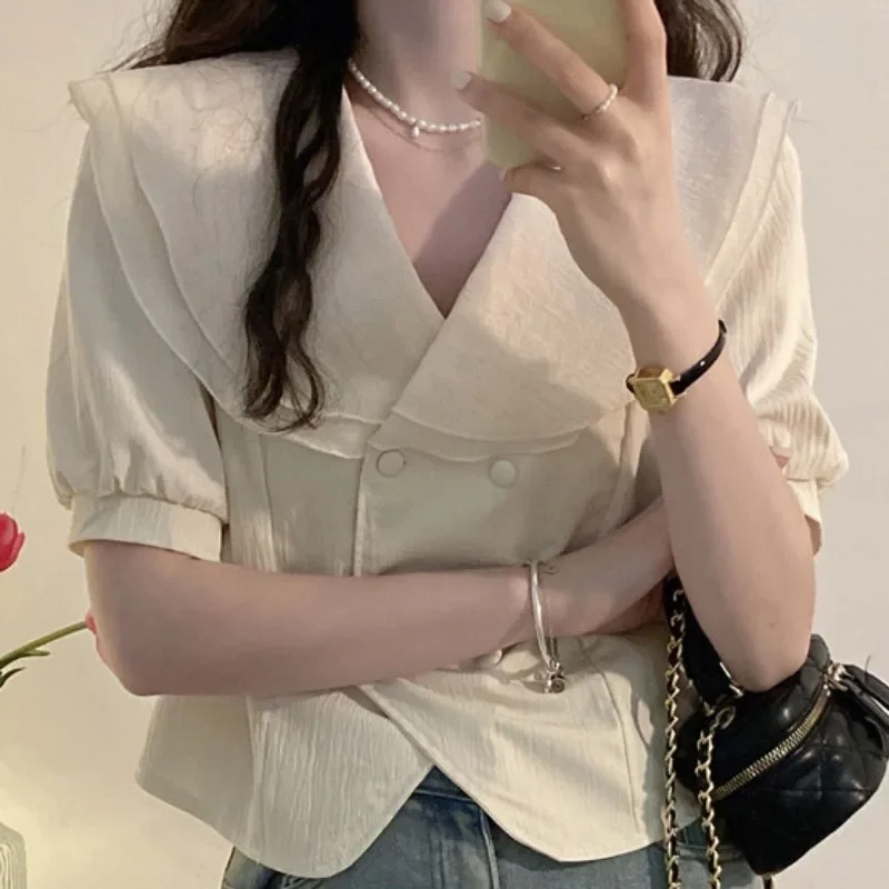 Camicia fresca a maniche corte da donna Estate 2025 Camicie con colletto alla Peter Pan in stile coreano con bordo a foglia di loto