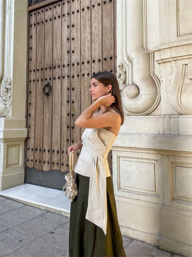 سترة نسائية مثيرة غير متماثلة بدون حمالات قابلة للطي بدون أكتاف بدون أكمام سترة نسائية موضة صيف 2024 ملابس خروج نسائية