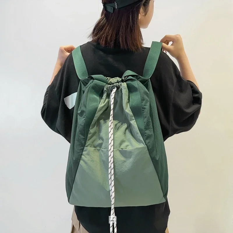 

Simple Versatile Nylon Shoulder Bags Solid String Large Capacity High Quality Backpack for Women 2025 Casual Schoolbags