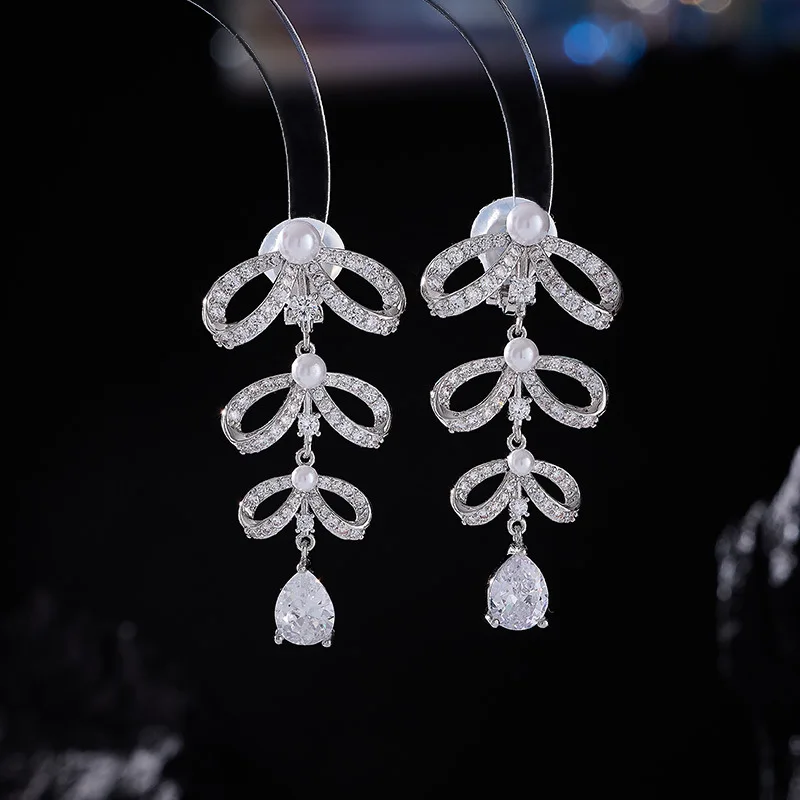 

Zircon earrings set with bow pearls, no ear piercings, ear clips and tassels