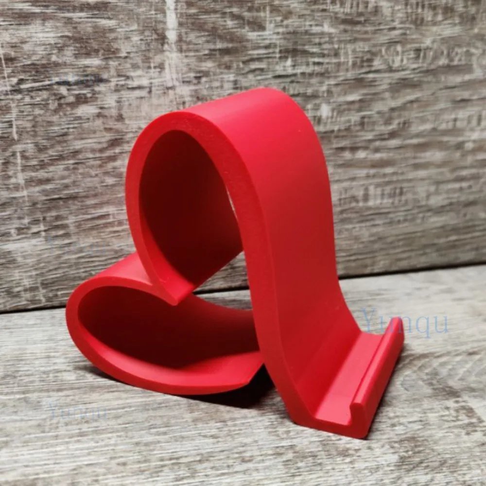 One Heart-Shaped Phone Stand, A 3D Printed Universal Phone and Tablet Stand, An Elegant Desktop Organizer in Multiple Colors