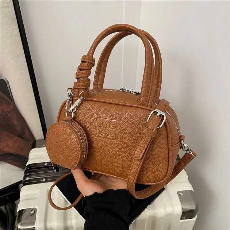 

Women's Minimalist Glossy Leather Cylinder Bag 2026 New Arrival Elegant Handheld Shoulder Crossbody Purse