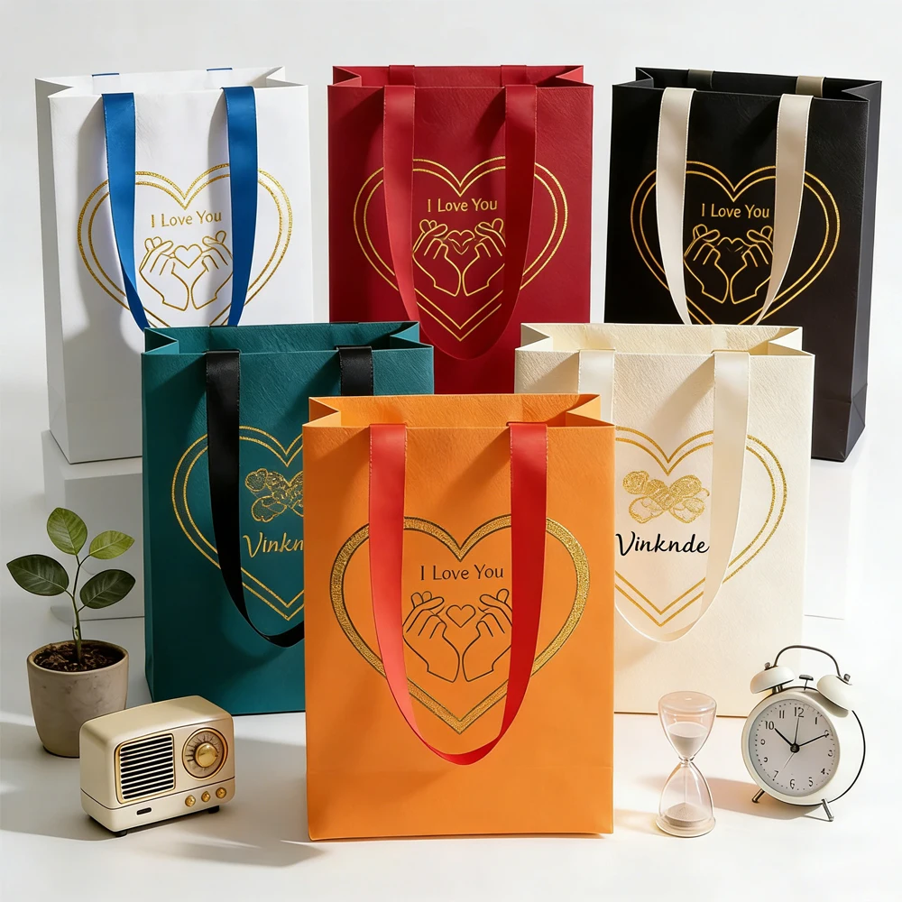 

Подарочные бумажные пакеты с индивидуальным логотипом для ювелирных изделий, свадебных подарков, конфет, косметики, свечей и масел.