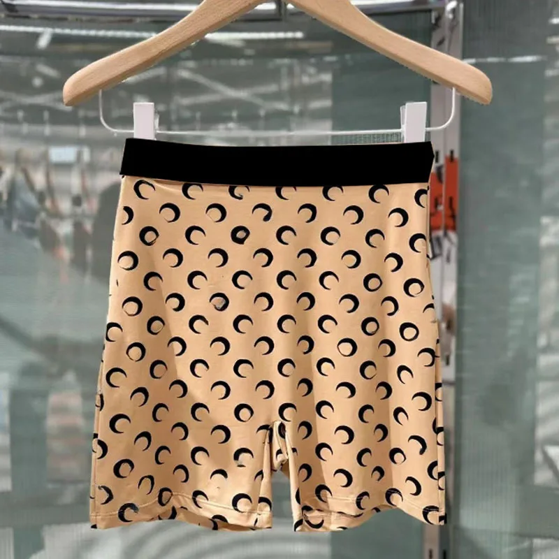 [nude pink moon shorts] black pants