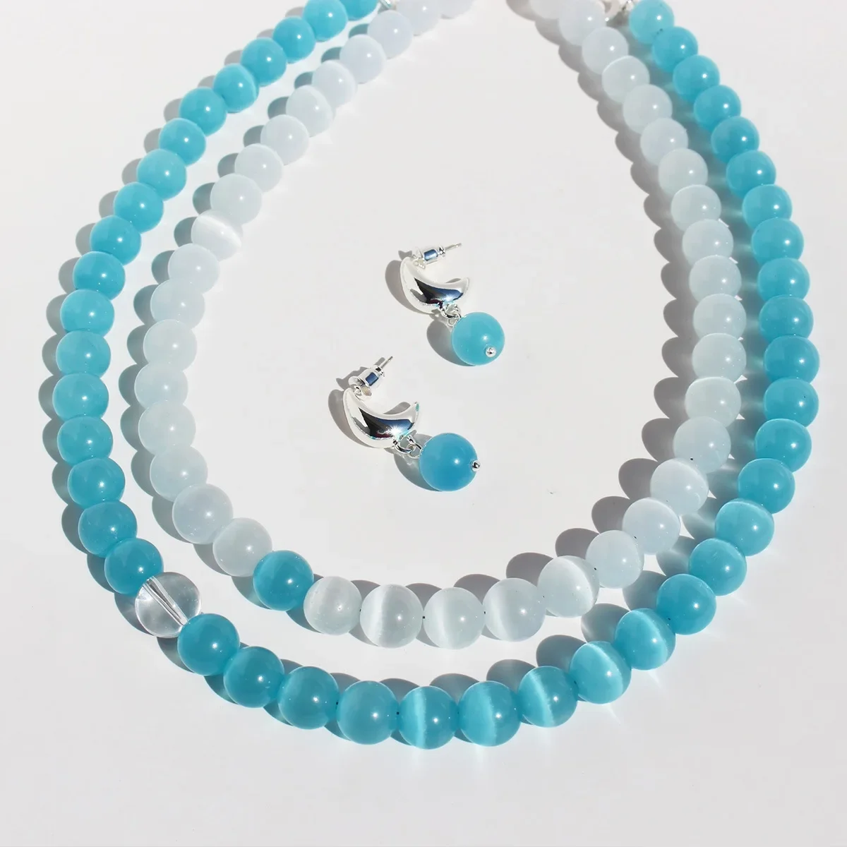 

Refreshing Blue Cat's Eye Beaded Necklace Earrings Set for Woman Transparent Stone OT Buckle Clavicle Chain Earrings Jewelry Set