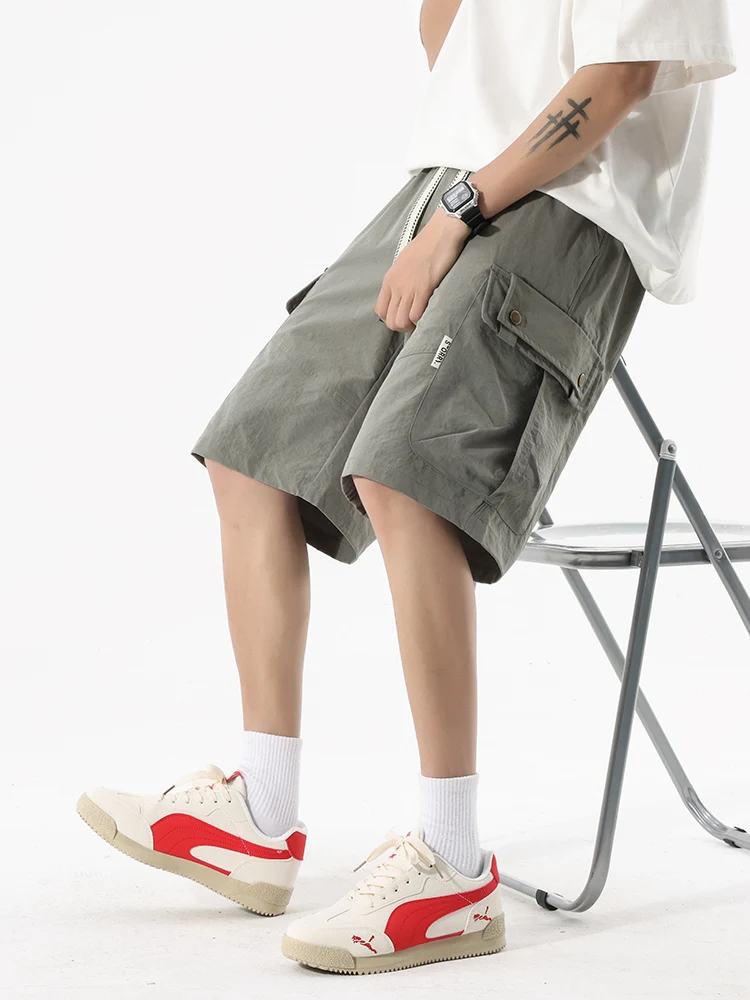 Short de travail multi-poches pour hommes, grande taille, soie glacée, séchage rapide, taille élastique, cordon de serrage, design tendance, cinq pantalons, nouvelle collection été