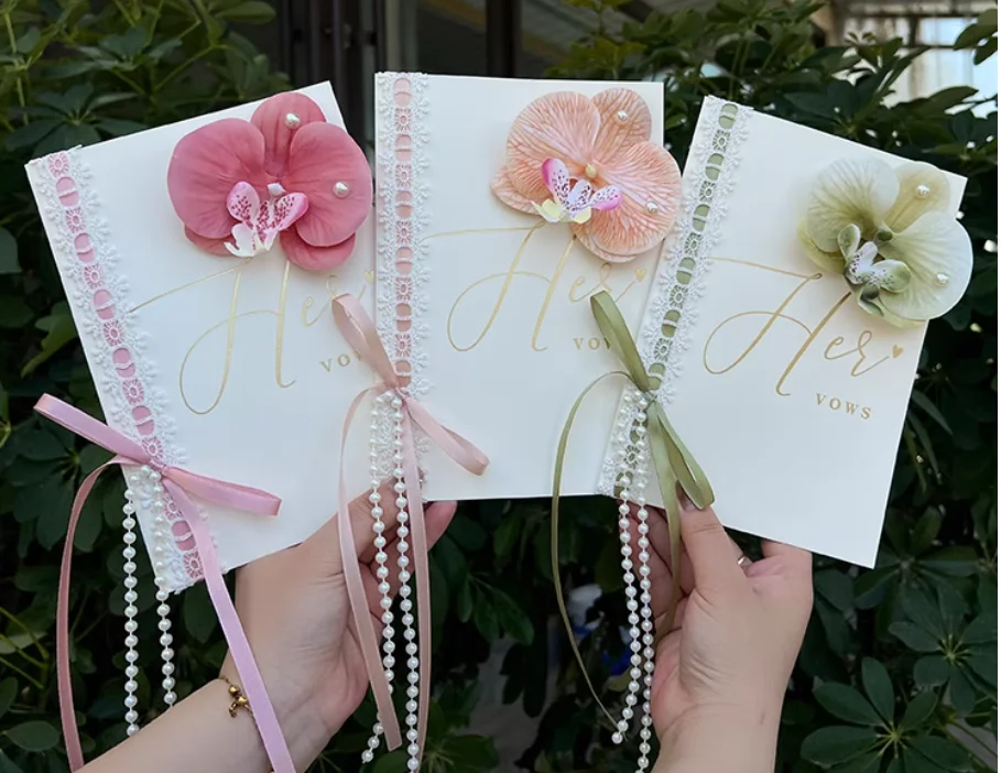 

8-piece package including Phalaenopsis orchids, wedding vows card, and handwritten wedding vows card.