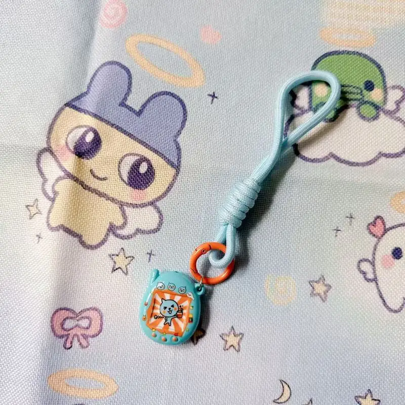 لطيف Tamagotchi الكرتون أنيمي المفاتيح الإبداعية النايلون الحبل للهواتف المحمولة والحقائب - هدية مثالية للصديقات