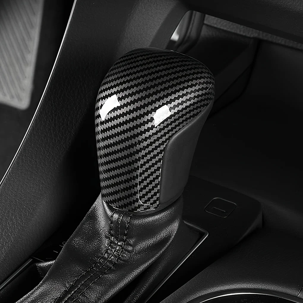 Carbon fiber gear shift knob cover for automobiles, suitable for Toyota Camry, Arthur, Avalon, and Levin models 2019-2021.