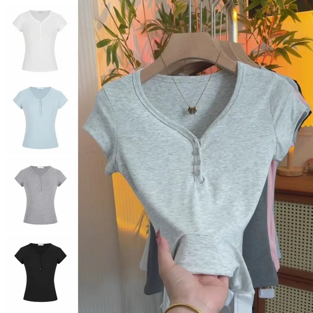 Retro fino ajuste manga curta camiseta botão chique colheita topo feminino simples cor sólida com decote em v camisetas topo streetwear