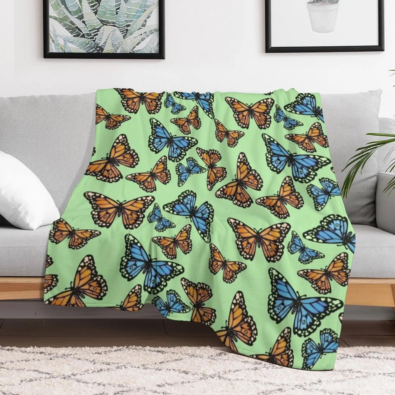 Blue and Orange Monarchs on Pastel Green Throw Blanket