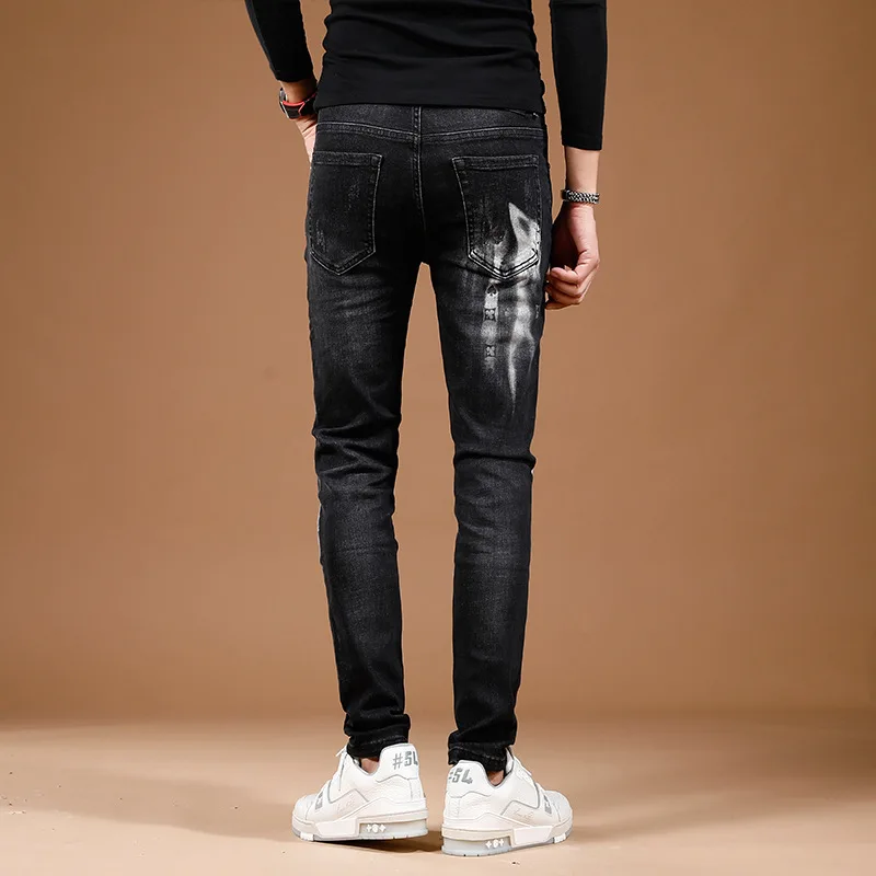 Celana Jeans hitam untuk pria, celana panjang Denim modis jalanan bercetak, celana ketat elastis untuk pria