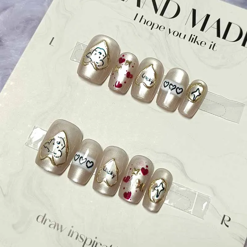 10 ชิ้นน่ารักการ์ตูนหัวใจสีทองและสุนัขกดบนเล็บสไตล์ฝรั่งเศส Polka Dot Bowknot เล็บที่ถอดออกได้ Cat Eye Design เล็บ