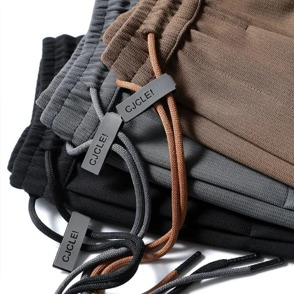 

Men's Casual Drawstring Waist Pants Multiple Colors Metal Tag Streetwear Athletic Loose Trousers