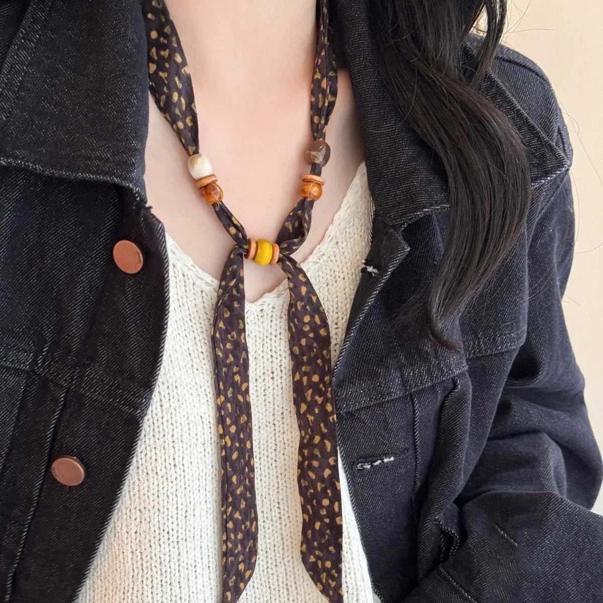 

Retro Fabric Wooden Bead Necklace Elegant and versatile sweater chain Unique niche design statement jewelry