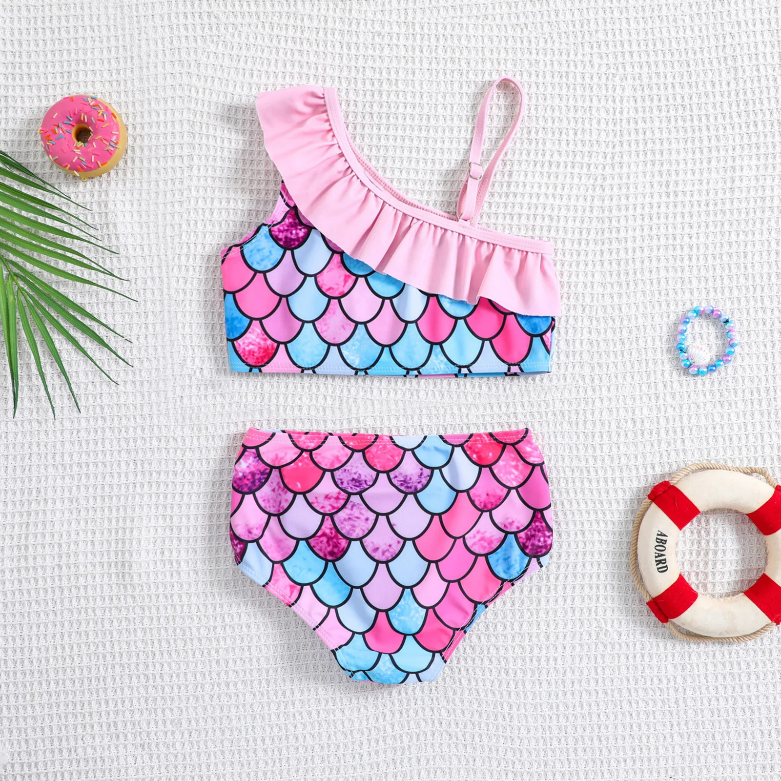 Baby two piece swimsuit printed with colorful fish scale pattern suitable for seaside trips and pool water play