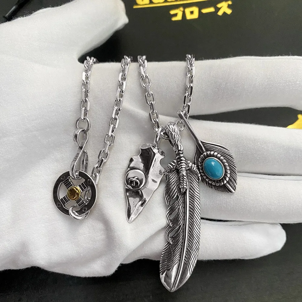 

Takahashi Goro's Goro Vintage Thai Silver Chicken Claw Feather with Withered Leaves and Turquoise Couple's Necklace