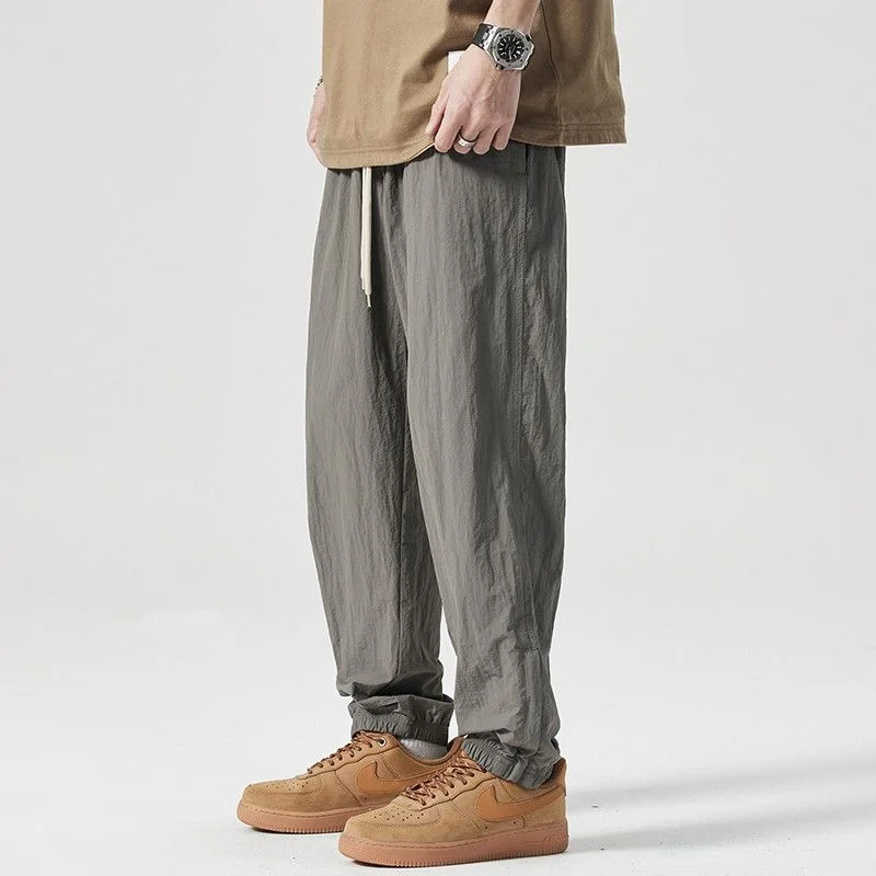 

Мужские летние тонкие быстросохнущие спортивные брюки свободного кроя с манжетами, повседневные, на молнии, облегающие, модные, из полиэфирного волокна, длинные, на все сезоны