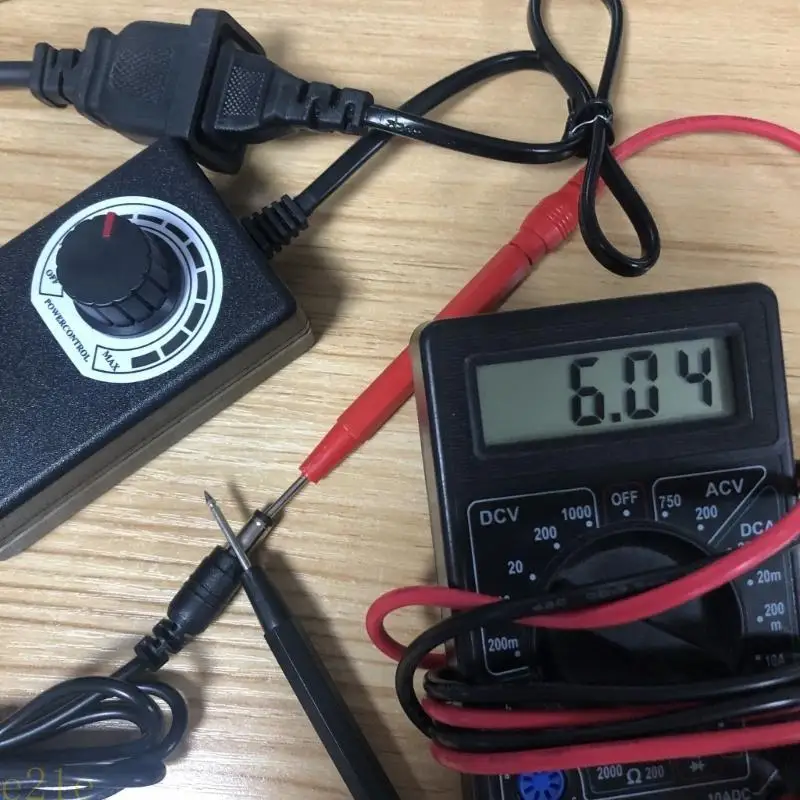 

E21E AC 100-240V to 4-12V Switching Universal Adapter Regulated Power Supply