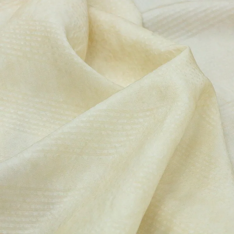 

The traditional artist-dyed tussah silk blended fabric in apricot color is a designer for Chinese Hanfu and cheongsam clothing