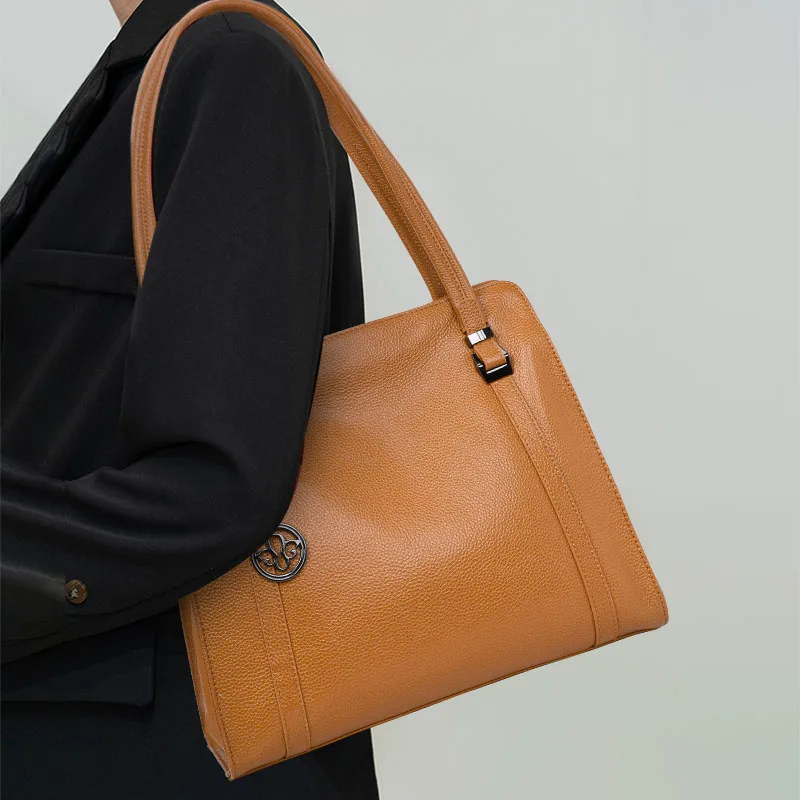 

Aidrani Tan Leather Tote: Signature Charm Accent & Timeless Brand Appeal