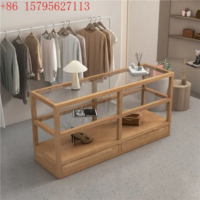 

Стеллаж для демонстрации одежды Nakajima: Стеклянная витрина-стойка для товаров