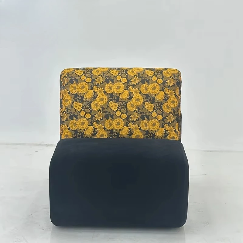 Modern and stylish yellow patterned upholstered lounge chair with black wood frame, suitable for living and dining rooms