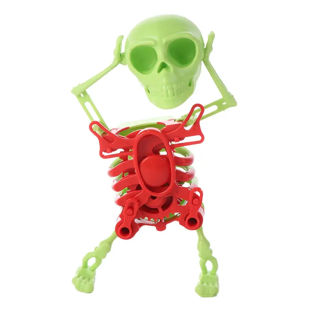 Plastikowy nakręcany tańczący szkielet symulujący ruch, drgaący szkielet drukowany w 3D, tańcząca czaszka, ruchoma szkieletowa czaszka na sprężynę, nakręcana mechanizmami.