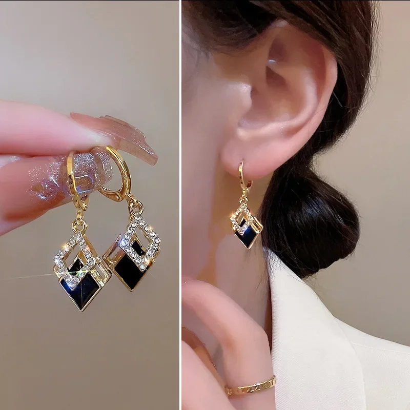 

2026 Trending Black Rhinestone Statement Earrings for Women, featuring Korean-style gold-tone hoops with layered diamond-shaped pendants.