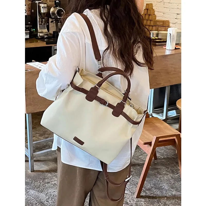 Shoulder bag for women, new niche design, large capacity multifunctional briefcase, commuting handheld crossbody bag handbag